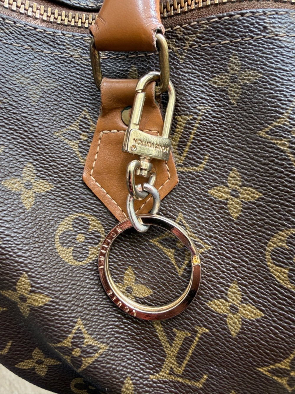 Louis Vuitton Monogram Key Ring with Gold Hardware.
